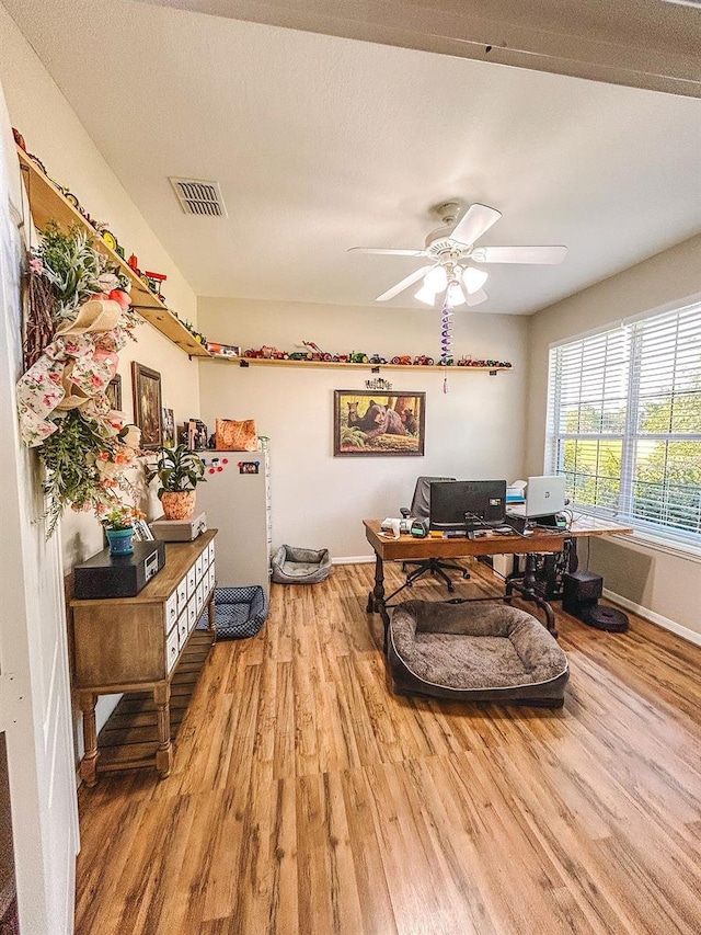 33818 Venice Ln, Sorrento, FL 32776 - home office with wood finished floors, baseboards, and a ceiling fan
