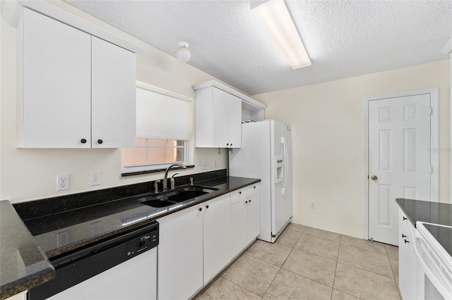 403 Duarte Ln, The Villages, FL 32159 - kitchen with a sink, white appliances, white cabinetry, a textured ceiling, and light tile patterned floors