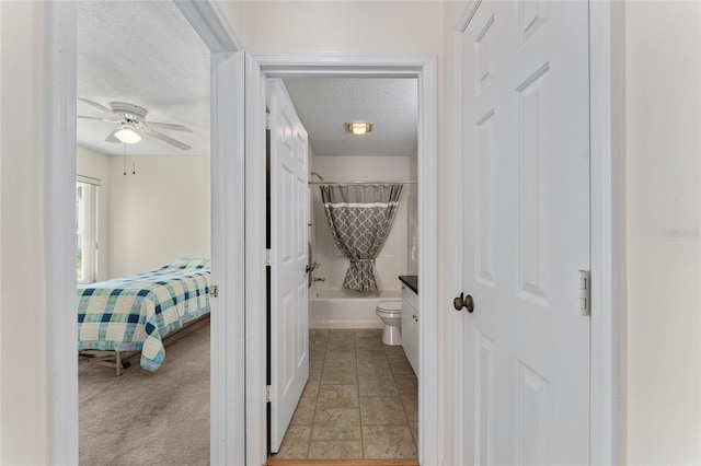 403 Duarte Ln, The Villages, FL 32159 - bathroom with a textured ceiling, a ceiling fan, toilet, and bathtub / shower combination