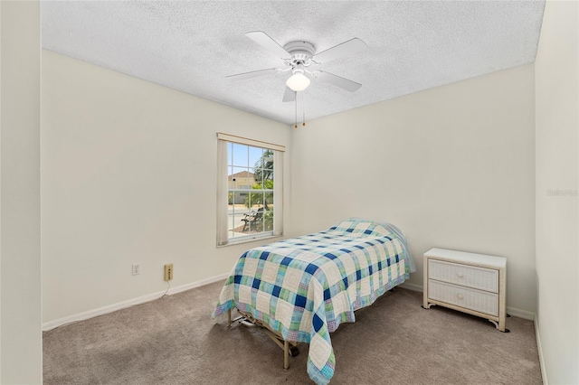 403 Duarte Ln, The Villages, FL 32159 - bedroom featuring carpet flooring, a textured ceiling, baseboards, and ceiling fan