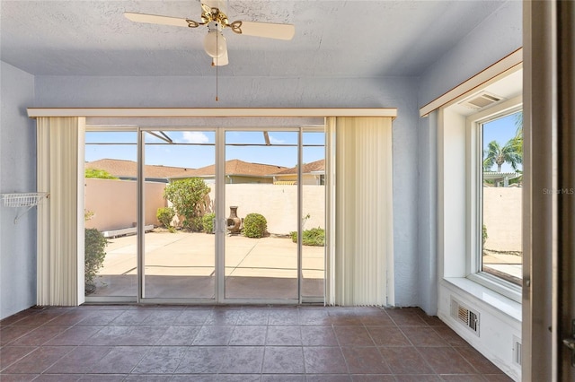 403 Duarte Ln, The Villages, FL 32159 - unfurnished sunroom with healthy amount of natural light