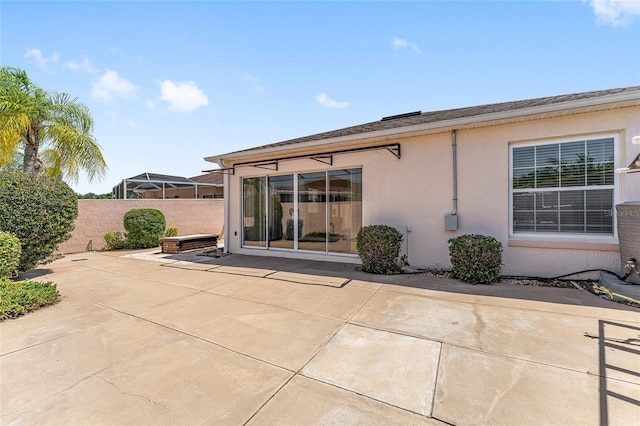 403 Duarte Ln, The Villages, FL 32159 - back of property with stucco siding, a patio area, and a fenced backyard