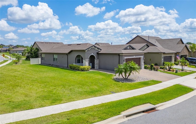 503 Vigo St, Davenport, FL 33837 - view of front of property with an attached garage, stucco siding, driveway, and a front yard
