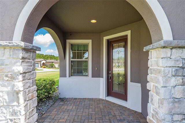 503 Vigo St, Davenport, FL 33837 - doorway to property with stucco siding