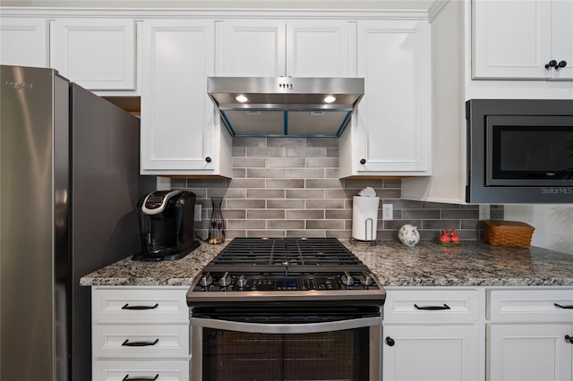 503 Vigo St, Davenport, FL 33837 - kitchen featuring appliances with stainless steel finishes, range hood, white cabinets, and backsplash