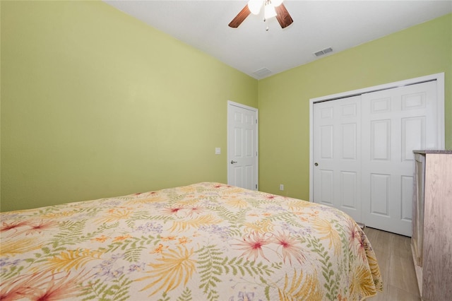 503 Vigo St, Davenport, FL 33837 - bedroom with light wood-style flooring, a closet, and ceiling fan