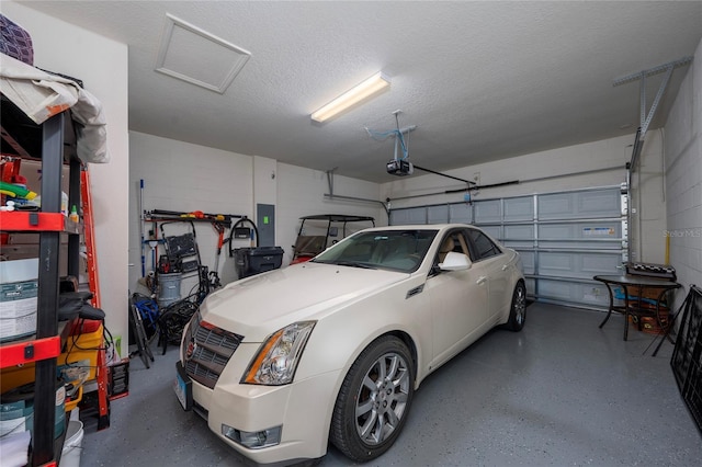 503 Vigo St, Davenport, FL 33837 - garage with a garage door opener, concrete block wall, and electric panel