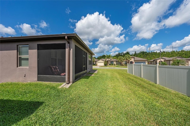 503 Vigo St, Davenport, FL 33837 - view of yard with a sunroom and a residential view