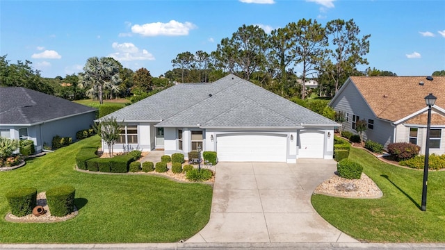 3393 Talley Ridge Dr, The Villages, FL 32162 - view of front of property featuring an attached garage, driveway, a front lawn, a shingled roof, and stucco siding