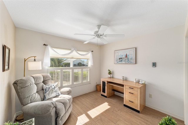 3393 Talley Ridge Dr, The Villages, FL 32162 - office area featuring baseboards, light wood-style floors, and ceiling fan
