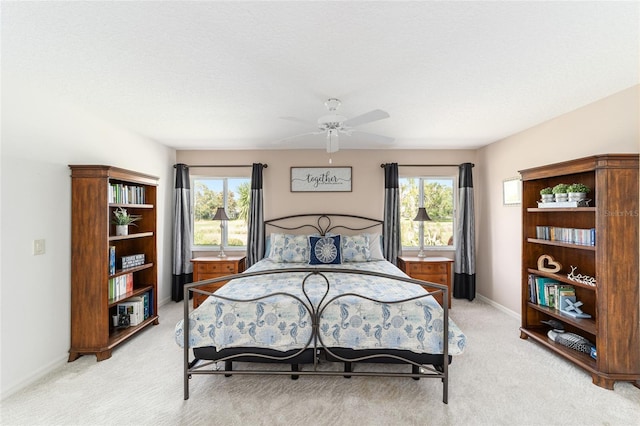 3393 Talley Ridge Dr, The Villages, FL 32162 - bedroom with multiple windows, light carpet, and baseboards