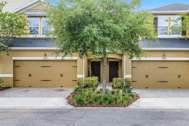 14430 Desert Haven St Unit 4302, Windermere, FL 34786 - multi unit property featuring stucco siding, decorative driveway, and a garage