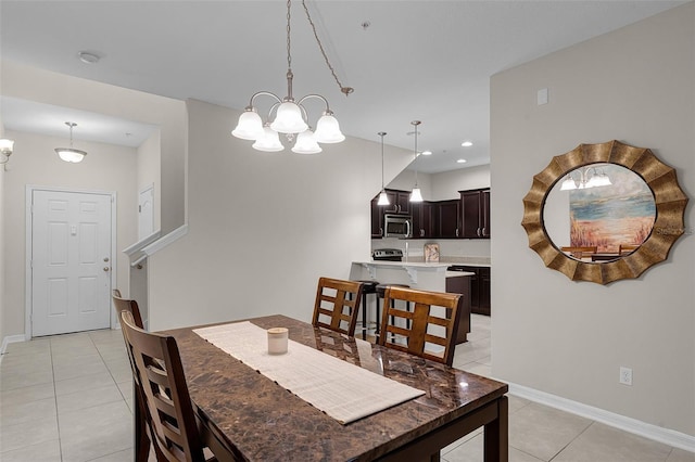 14430 Desert Haven St Unit 4302, Windermere, FL 34786 - dining area featuring light tile patterned floors, a chandelier, baseboards, and recessed lighting
