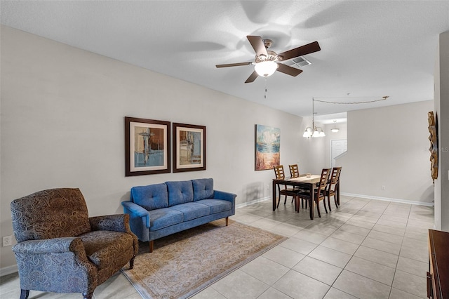 14430 Desert Haven St Unit 4302, Windermere, FL 34786 - living area featuring light tile patterned floors, a ceiling fan, a chandelier, and baseboards
