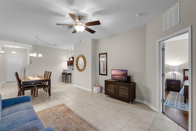14430 Desert Haven St Unit 4302, Windermere, FL 34786 - living area with ceiling fan, light tile patterned floors, baseboards, and a chandelier