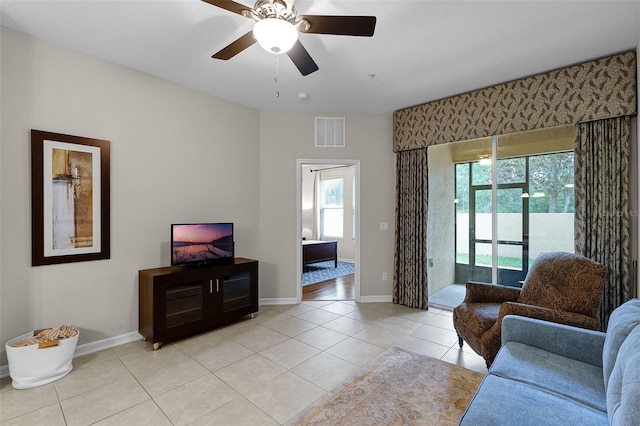 14430 Desert Haven St Unit 4302, Windermere, FL 34786 - living area with light tile patterned flooring, baseboards, and a ceiling fan