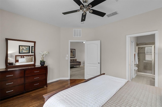 14430 Desert Haven St Unit 4302, Windermere, FL 34786 - bedroom featuring wood finished floors, baseboards, ceiling fan, and ensuite bathroom