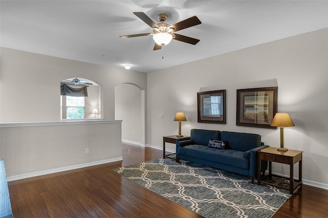 14430 Desert Haven St Unit 4302, Windermere, FL 34786 - living area featuring ceiling fan, wood finished floors, arched walkways, and baseboards
