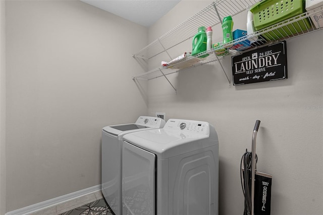 14430 Desert Haven St Unit 4302, Windermere, FL 34786 - laundry area with independent washer and dryer, tile patterned floors, and baseboards