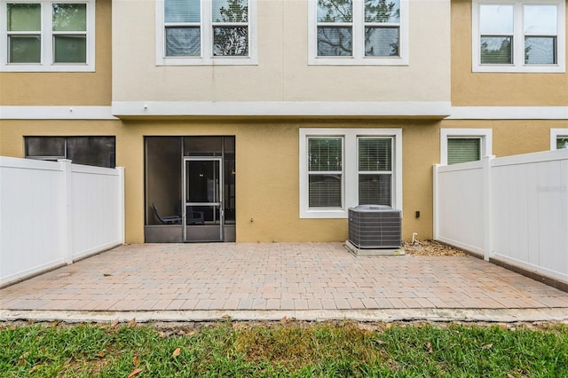 14430 Desert Haven St Unit 4302, Windermere, FL 34786 - rear view of property with central air condition unit, stucco siding, a patio, and fence