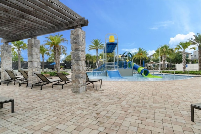 14513 Winter Stay Dr, Winter Garden, FL 34787 - communal playground with a water play area, a pergola, and a patio area