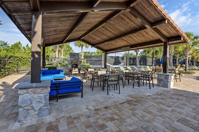 14513 Winter Stay Dr, Winter Garden, FL 34787 - view of patio / terrace with an outdoor living space with a fireplace