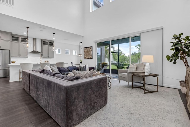 14513 Winter Stay Dr, Winter Garden, FL 34787 - living area with a towering ceiling and dark wood-style floors