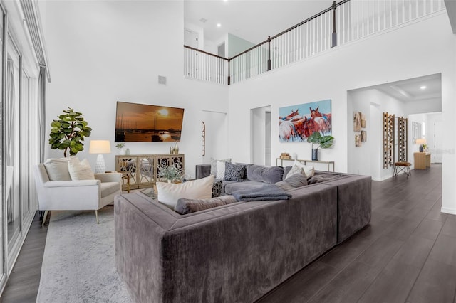 14513 Winter Stay Dr, Winter Garden, FL 34787 - living area with dark wood-style floors, a towering ceiling, baseboards, and recessed lighting
