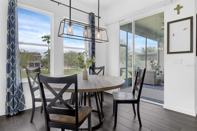 14513 Winter Stay Dr, Winter Garden, FL 34787 - dining room featuring dark wood finished floors and baseboards