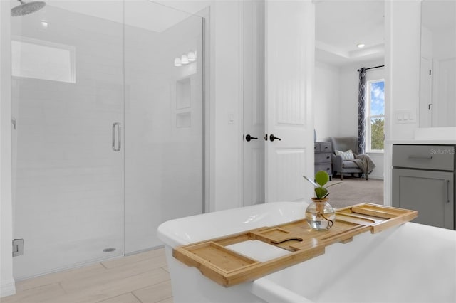 14513 Winter Stay Dr, Winter Garden, FL 34787 - ensuite bathroom featuring a stall shower, a freestanding tub, and vanity