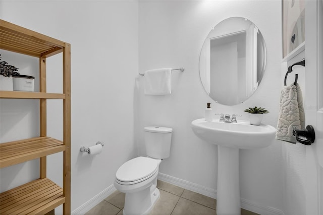 14513 Winter Stay Dr, Winter Garden, FL 34787 - half bathroom with toilet, tile patterned floors, and baseboards