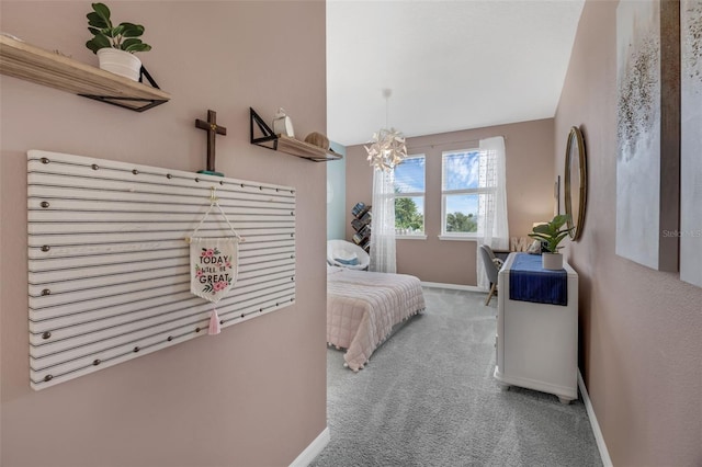 14513 Winter Stay Dr, Winter Garden, FL 34787 - bedroom featuring carpet, baseboards, and a chandelier