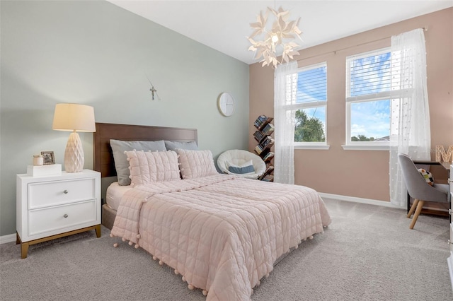 14513 Winter Stay Dr, Winter Garden, FL 34787 - bedroom featuring light colored carpet, a chandelier, and baseboards
