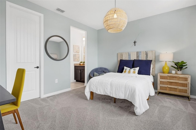 14513 Winter Stay Dr, Winter Garden, FL 34787 - carpeted bedroom featuring baseboards and connected bathroom