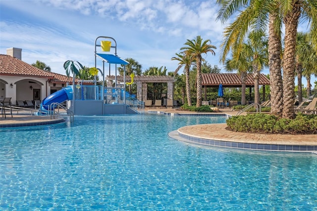 14513 Winter Stay Dr, Winter Garden, FL 34787 - community pool with a water slide and a patio area