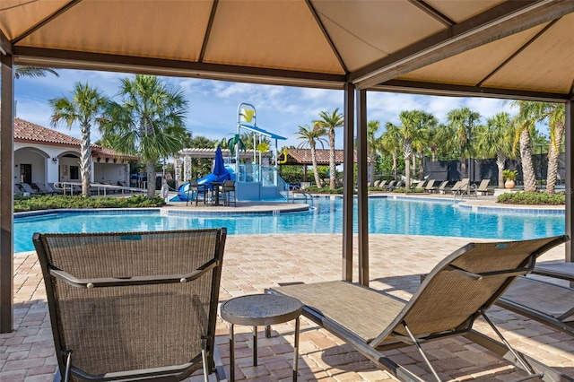 14513 Winter Stay Dr, Winter Garden, FL 34787 - community pool featuring a gazebo, a water slide, and a patio