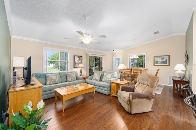 living room featuring dark wood finished floors, a ceiling fan, lofted ceiling, ornamental molding, and baseboards