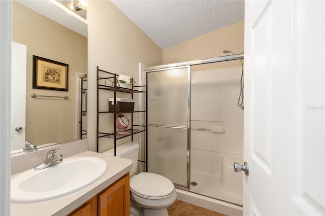 full bath with toilet, a textured ceiling, a shower with door, vanity, and tile patterned floors