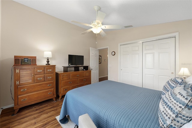 bedroom featuring wood finished floors, a closet, and ceiling fan