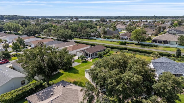 aerial view of residential area with a nearby body of water