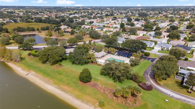 view of property location with a large body of water and a pool
