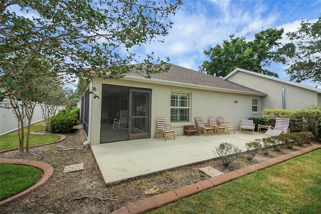 1828 Hollow Branch Way, The Villages, FL 32162 - back of property with fence, stucco siding, a patio, and roof with shingles
