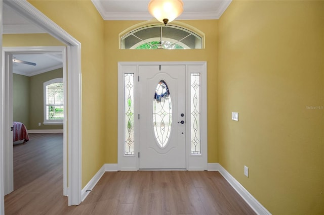 1828 Hollow Branch Way, The Villages, FL 32162 - entryway with wood finished floors, ornamental molding, and baseboards