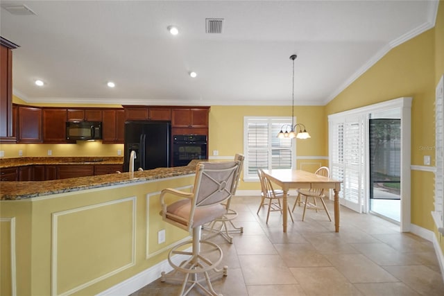 1828 Hollow Branch Way, The Villages, FL 32162 - kitchen featuring black appliances, lofted ceiling, dark stone countertops, ornamental molding, and a chandelier