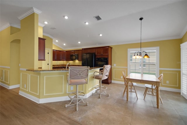 1828 Hollow Branch Way, The Villages, FL 32162 - kitchen featuring black appliances, crown molding, lofted ceiling, a chandelier, and dark brown cabinets