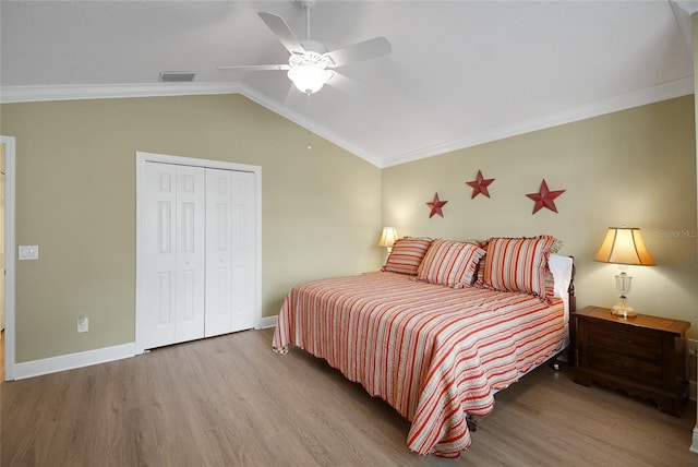 1828 Hollow Branch Way, The Villages, FL 32162 - bedroom with wood finished floors, a closet, lofted ceiling, baseboards, and ceiling fan