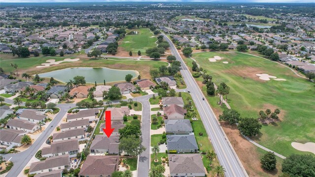 1828 Hollow Branch Way, The Villages, FL 32162 - aerial view of property's location with a golf course, a nearby body of water, and nearby suburban area