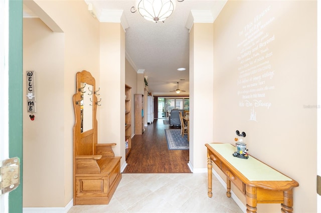 616 Hartford Ln, The Villages, FL 32162 - corridor featuring crown molding, arched walkways, baseboards, and a textured ceiling