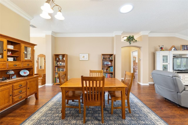 616 Hartford Ln, The Villages, FL 32162 - dining space featuring arched walkways, crown molding, dark wood-style floors, a chandelier, and baseboards