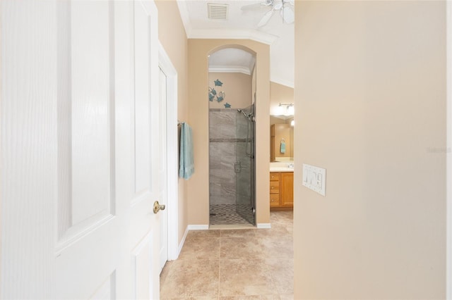 616 Hartford Ln, The Villages, FL 32162 - full bathroom featuring ornamental molding, a stall shower, ceiling fan, vanity, and baseboards